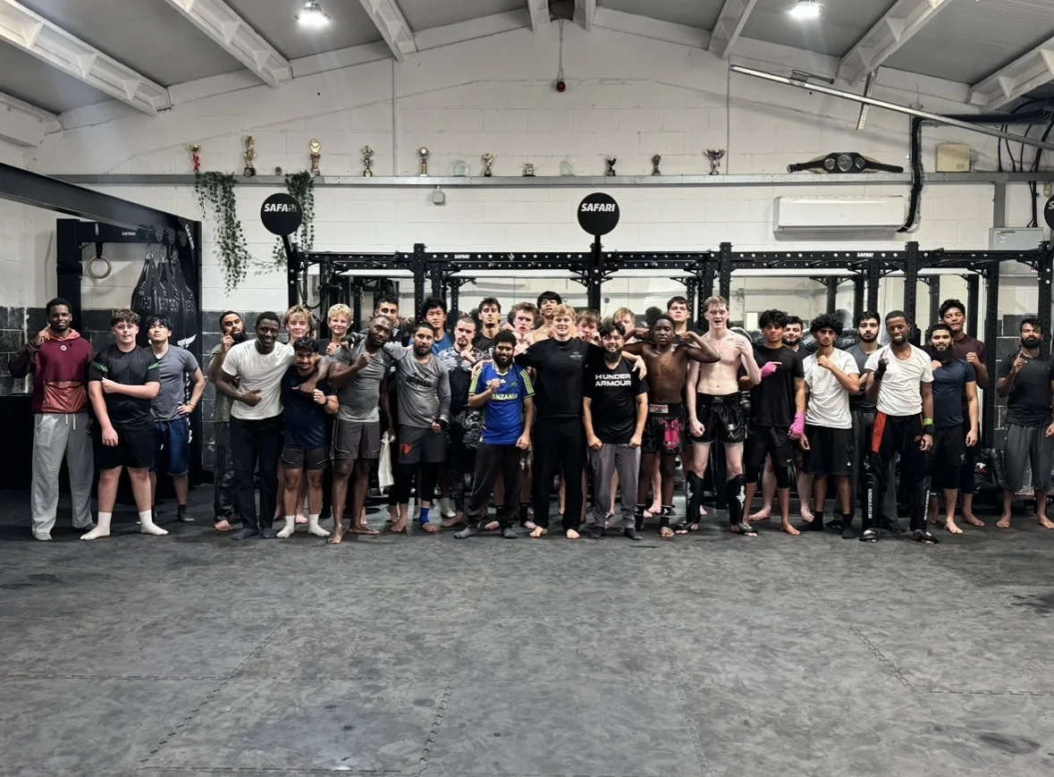 Members and supporters on the mats at Safari MMA after Hayden Knight's final coaching session.